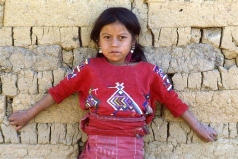 Portrait Of A Mayan Girl Extending Her Arms Against A Wall Chajul