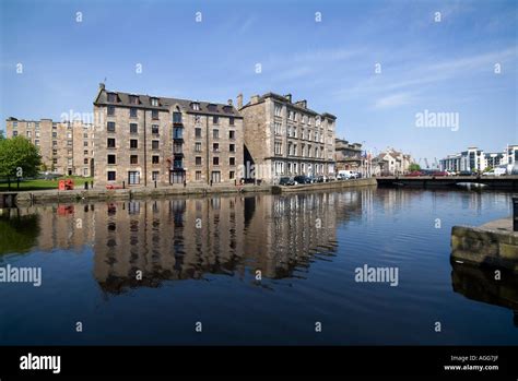 Buildings Reflected In Water Of Leith Edinburgh Scotland Stock Photo