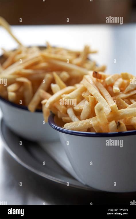 French Fries Chips In Enamel Bowls Stock Photo Alamy