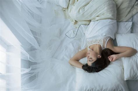 Pretty Woman Lying Down On Her Bed At Home Stock Photo Image Of