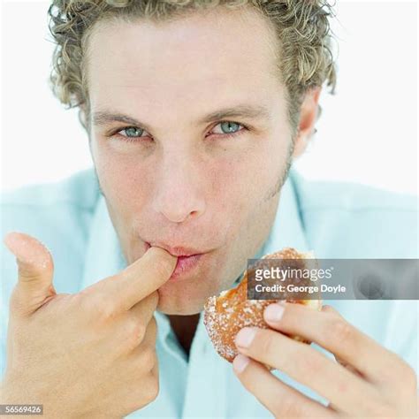Hungry Man Lick Finger Photos And Premium High Res Pictures Getty Images