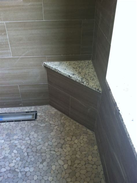 Walk In Shower With Pebble Floors Solid Surface Corner Bench And Tile