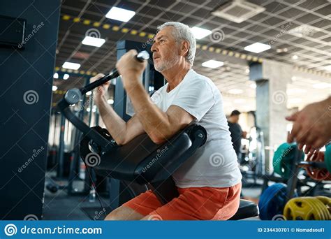 Elderly Man Workout On Exercise Machine In Gym Stock Image Image Of