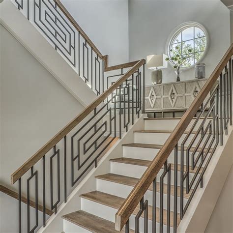 A monochromatic color scheme was used throughout the modern railing interior to reach a balanced look that isn't excessively bold. Grande Custom Stairwell | Modern stair railing, Railing design, Stairway design