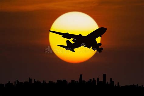 Wing Of An Airplane Flying Above The City At Sunrise Stock Image