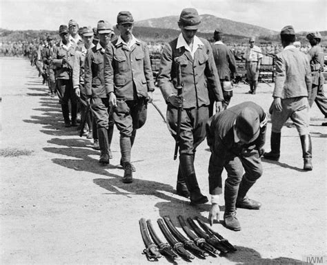 Japanese Officers Surrender Their Swords To The 25th Indian Div At