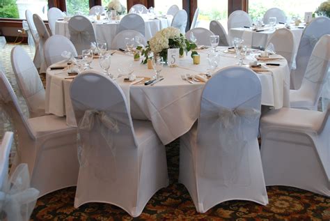 This is when brides and grooms can get a bit stressed. Wedding reception decor, white chair covers, white spandex ...