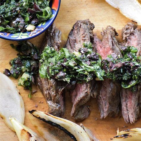 This Grilled Flank Steak Topped With An Irresistible Olive And Herb Topping Is An Impressive