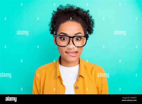 Photo Portrait Girl Curly Hairstyle Wearing Glasses Biting Lip Isolated Vivid Teal Color
