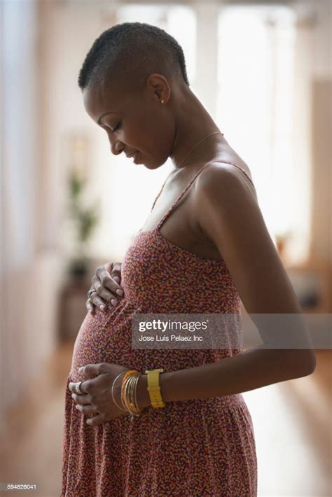 Black Woman Rubbing Her Pregnant Belly Photo Getty Images