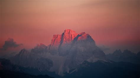 Download Wallpaper 1366x768 Peaks Mountains Glowing Summits Sunset
