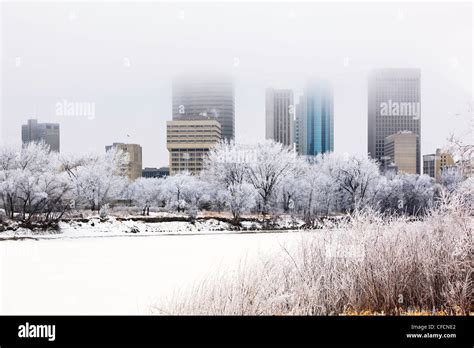 Downtown Winnipeg Skyline And Frozen Red River On A Frosty Winter Day