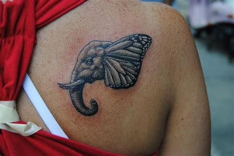 Maybe you would like to learn more about one of these? Elephant and Butterfly Wing Tattoo by Cory Hand at The ...
