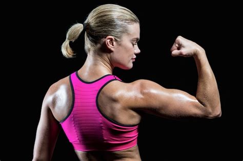 premium photo muscular woman flexing her arm