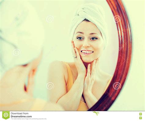 Woman Having A Look At Her Face At The Mirror Stock Image Image Of