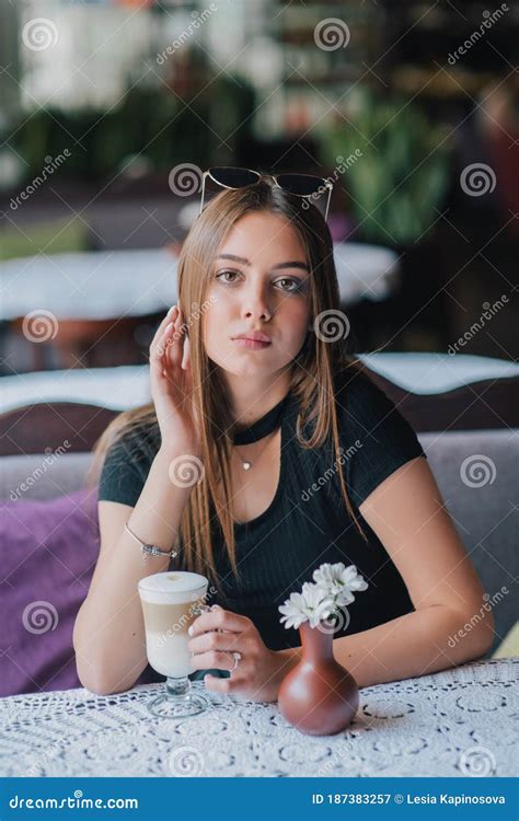Woman Drinking Coffee In The Morning At Restaurant Soft Focus Smiling