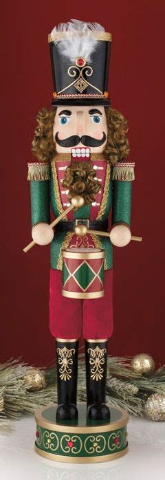This beautiful 32” Drummer Nutcracker stands at the ready with his