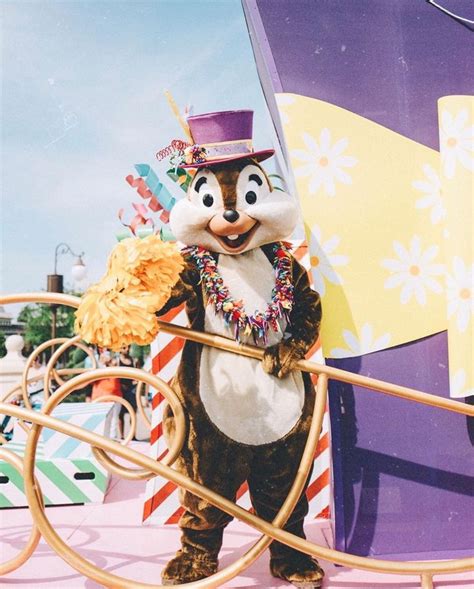 A Person In A Costume Standing On A Roller Coaster