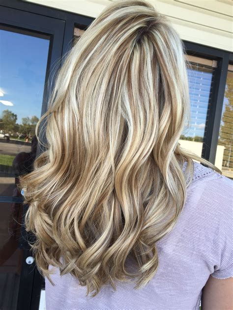 Blonde hair with lowlights is beautiful, and it will give a woman the opportunity to change her appearance without doing much. Stunning ice blonde and chocolate brown lowlight. https ...