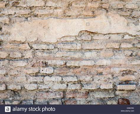 Old Damaged Rustic Brick Wall With Plaster Texture