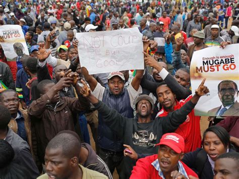 Thousands March In Zimbabwe Against President Robert Mugabe After Military Put Longtime Ruler
