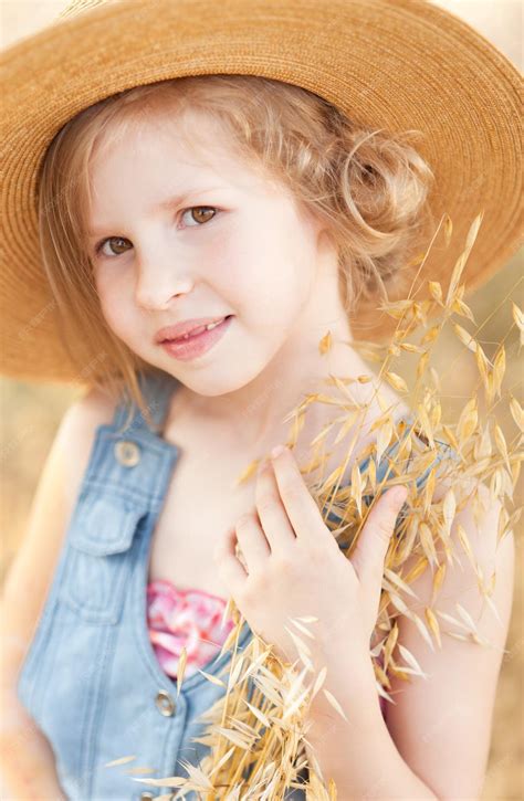 Premium Photo Cute Little Girl Wearing Hat Outdoors Rustic Style