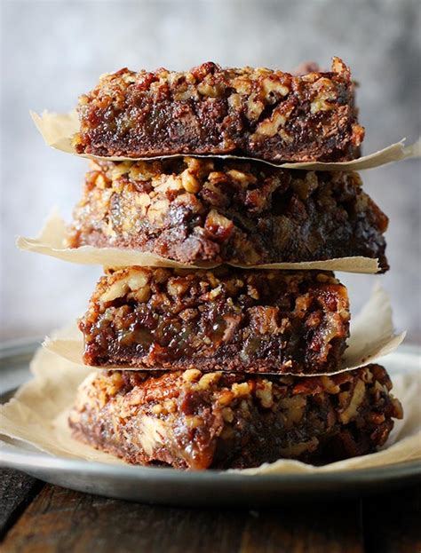 If you've never made pecan pie bars, imagine those gooey filling and toasty pecans of pie fame filling a simple crust and baked in a big pan instead of a pie plate. Chocolate Caramel Pecan Pie Bars | SoupAddict.com