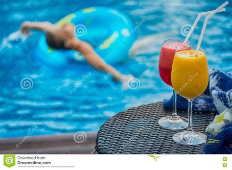 Two Cocktails Beside Swimming Pool Woman In Background Stock Image Image Of Woman Water