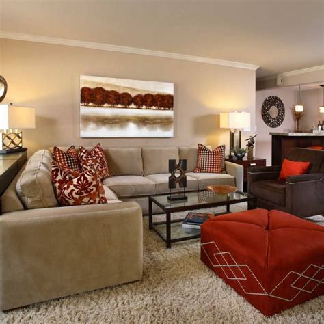 It can channel edgy modern and charming country; Room redo: Neutral living room with red accents in 2020 ...