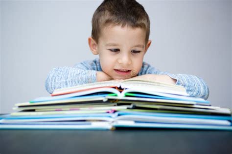 Little Boy Is Reading A Book Stock Image Image Of Brunette Reading
