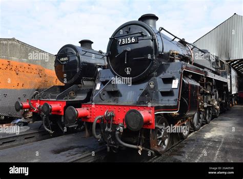 Two Black Steam Locomotives In A Railway Siding Stock Photo Alamy