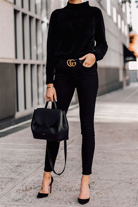 Woman Wearing Black Chenille Sweater Black Skinny Jeans Black Pumps