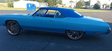 Check Out This 72 Donk Chevy Impala With A Porsche Panamera Cabin Swap