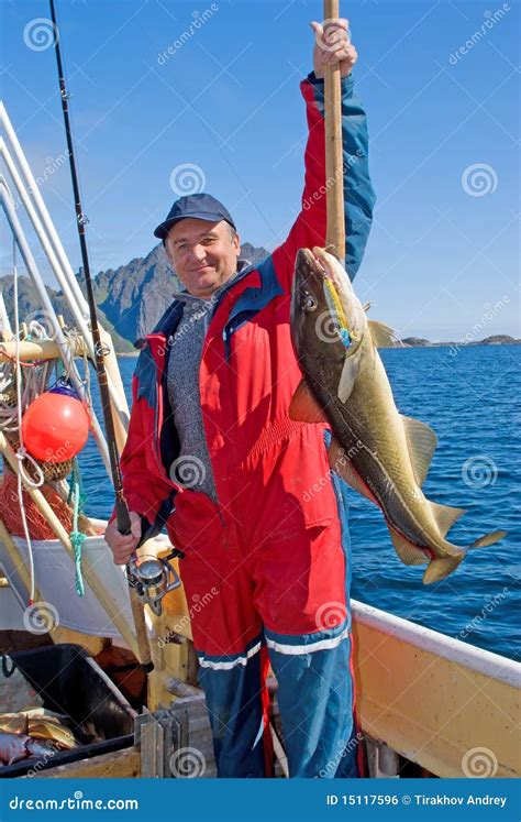 Fisherman With Big Fish And The Spinning Stock Photo Image Of Holiday