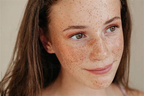 crop face natural beauty portrait of smiling girl with freckles by liliya rodnikova stocksy united