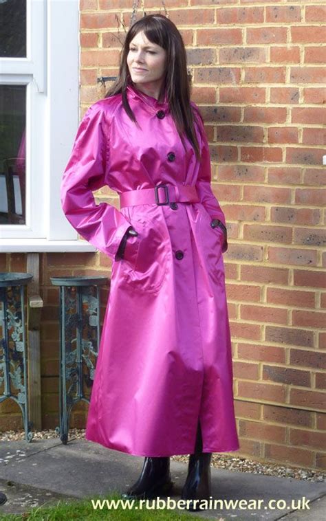 Debbie In Her Lovely Tightly Belted Pink Rubberized Satin Mackintosh