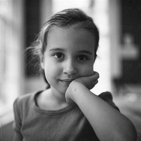 Black And White Portrait Of A Beautiful Young Girl Resting Her Head On