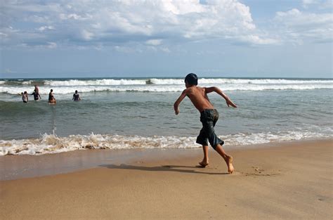 Leisure Activity Seashore Shirtless Daytime Motion Men Young