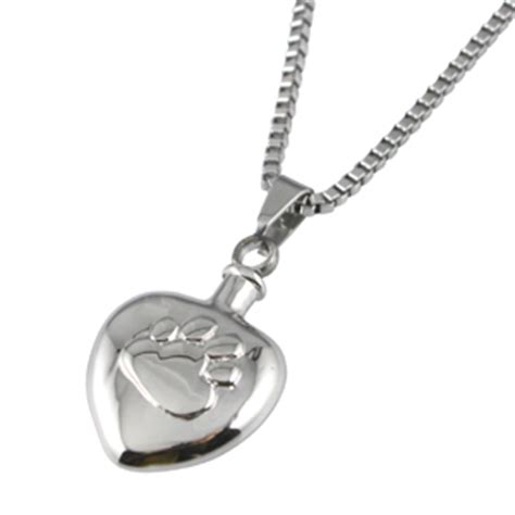 Wearing a delicate necklace or pendant with your pet's ashes in it. Pet Cremation Jewellery Chelsea 6 Paw Print Urn