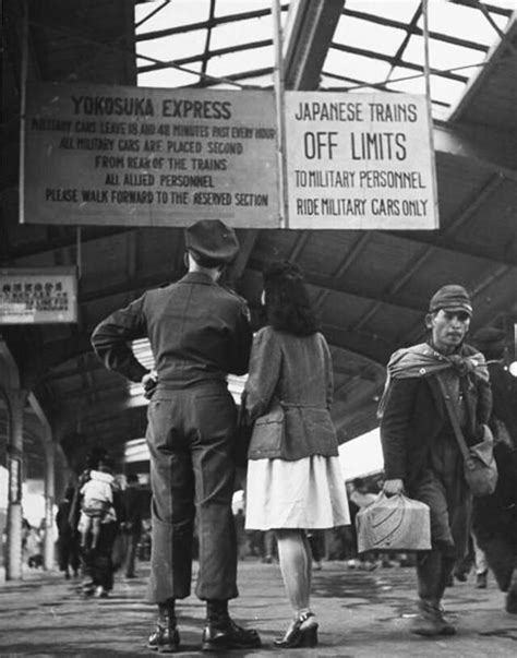 Us Soldier And His Japanese Girl Reading Military Restrictions About Riding Trains In American