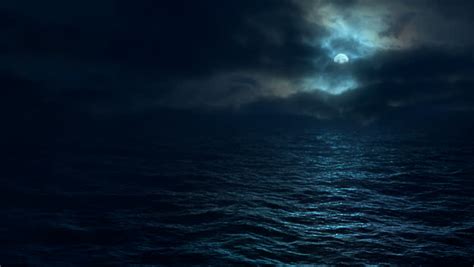 Flying Over Moonlit Ocean At Night Camera Tracks Slowly Over Dark