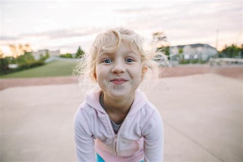 Adorable Little Blonde Caucasian Girl Child Making Funny Silly Face