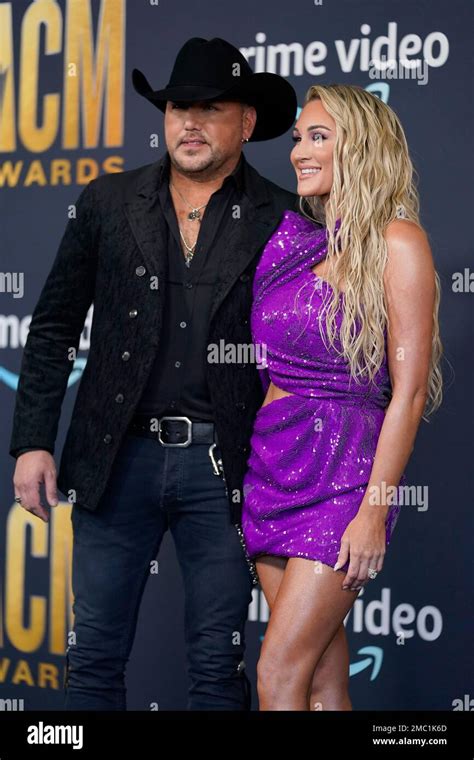 Jason Aldean Left And Brittany Kerr Arrive At The 57th Academy Of