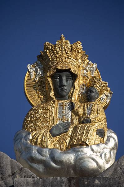 Close Up Of A Sculpted Black Madonna And Child On Top Of A Gate Of The
