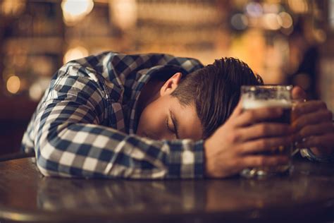 Young Drunk Man Sleeping On The Table In A Bar Stock Photo Download
