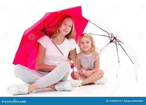 Two Girls Are Standing Under Umbrellas Stock Image Image Of Beach Beauty 133425273