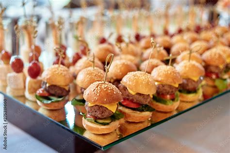 Buffet Table With Mini Hamburgers And Canape At Luxury Wedding