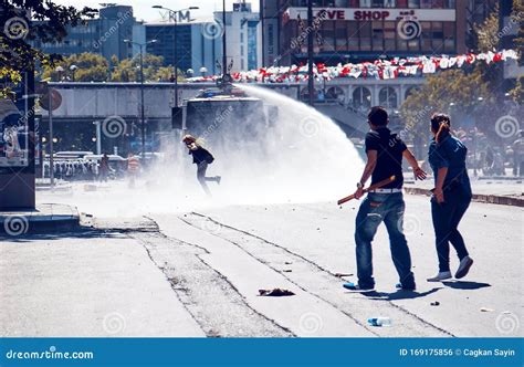 Young Protesters Against The Police Panzer Using Water Cannon During Gezi Park Protests In