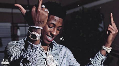 Smiley Nba Youngboy Is Wearing Stones Silver Chains Rings And White