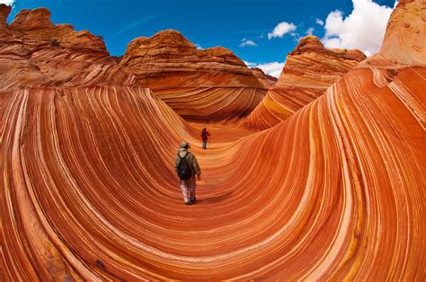 Hikers Exploring The Wave A 190 Million Year Old Jurassic Age Navajo